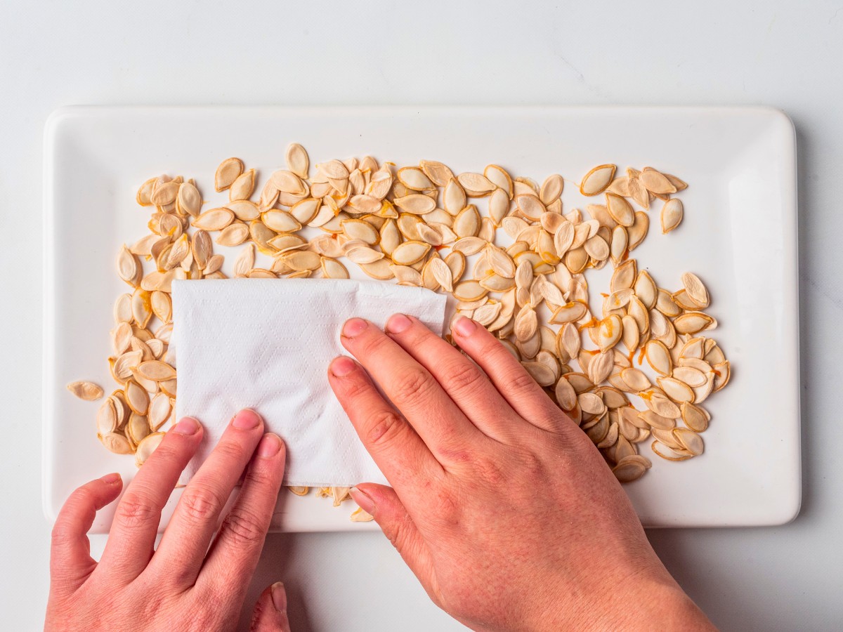 pat pumpkin seeds dry.